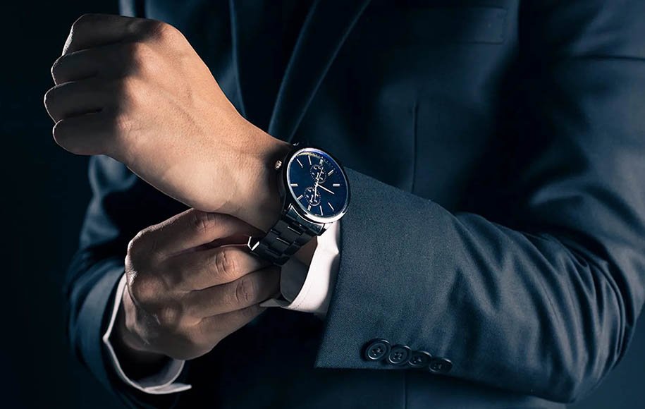 Three models of men's luxury wristwatches